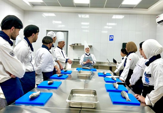 Chef Maysaa teaching in the kitchen